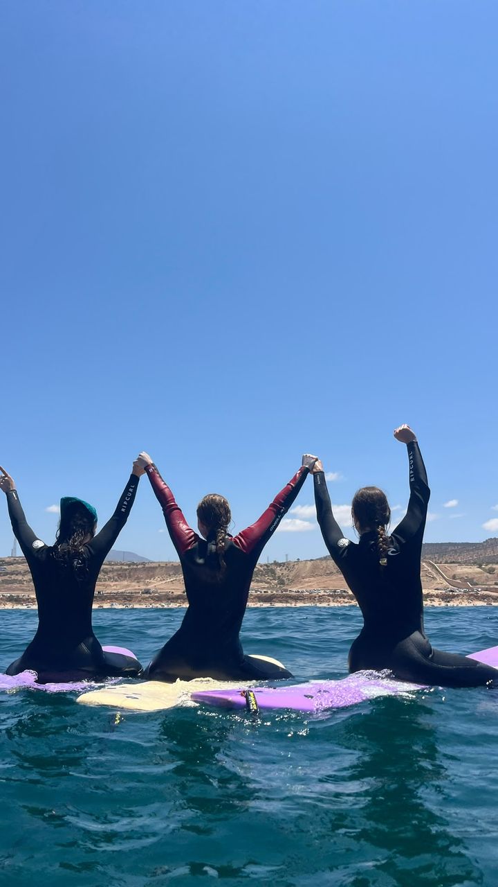 Students celebrating on their boards
