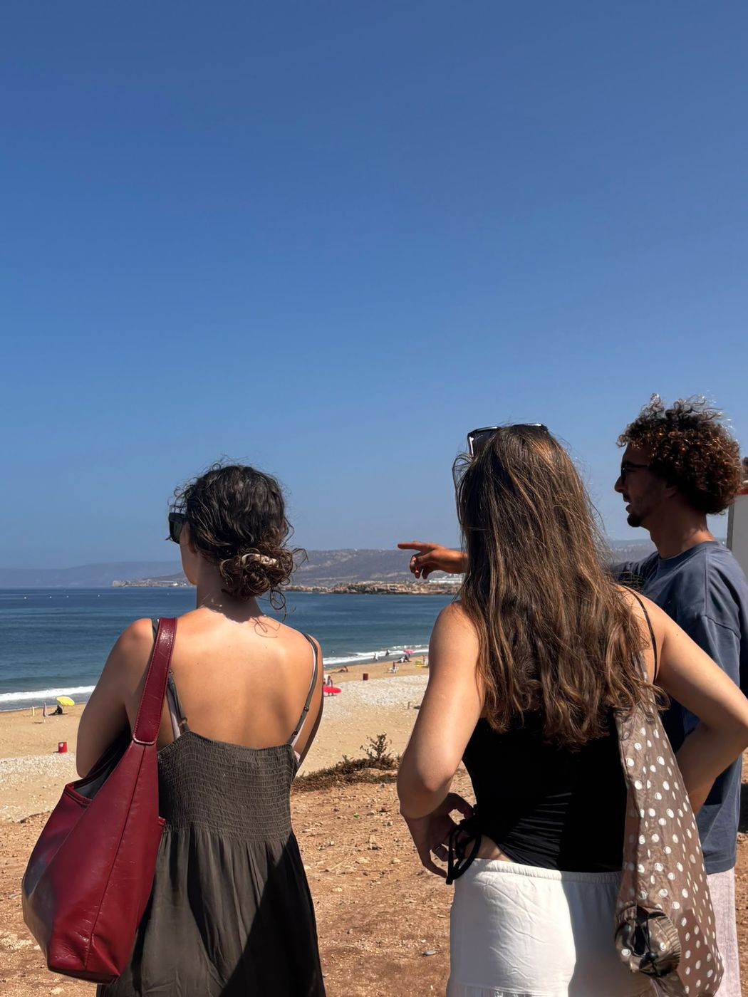 Coach pointing out the surf spot
