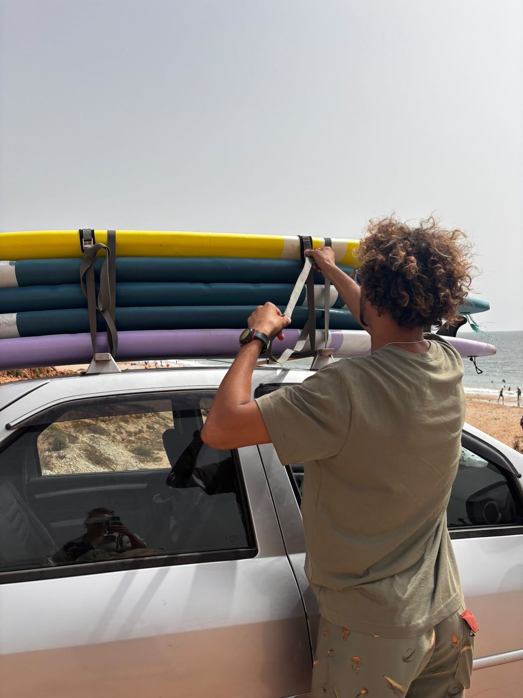 Loading surfboards on the car roof