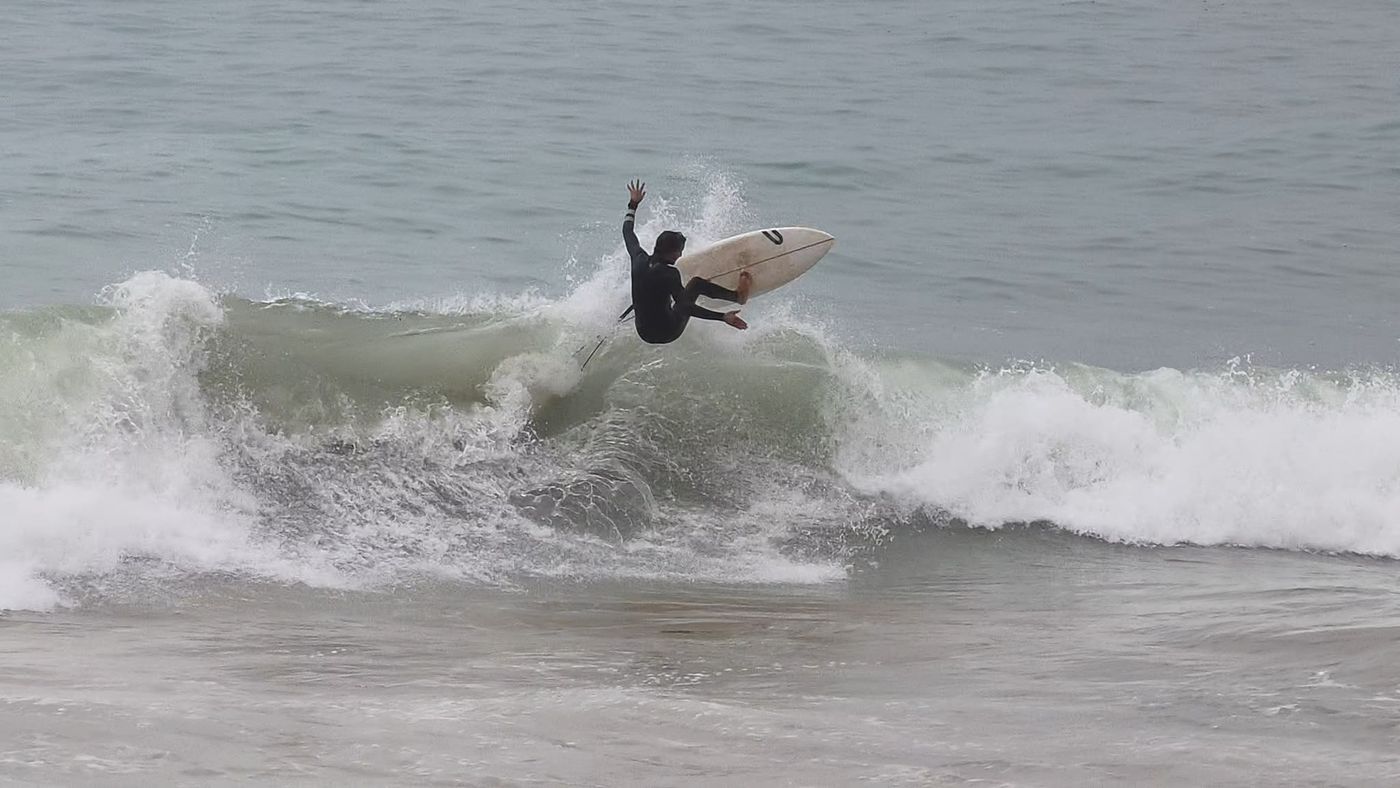 Surfer hitting the lip of a wave